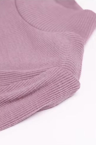 Textured fabric on the shoulder of a Women's Mock Neck Wool Top in Lily color, crafted from 100% wool for chic style and seasonal flexibility. From Borcelleclothes.