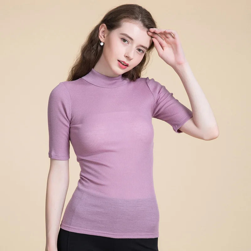 Women's Mock Neck Wool Top in Lily color, crafted from 100% wool for chic style and seasonal flexibility. From Borcelleclothes.