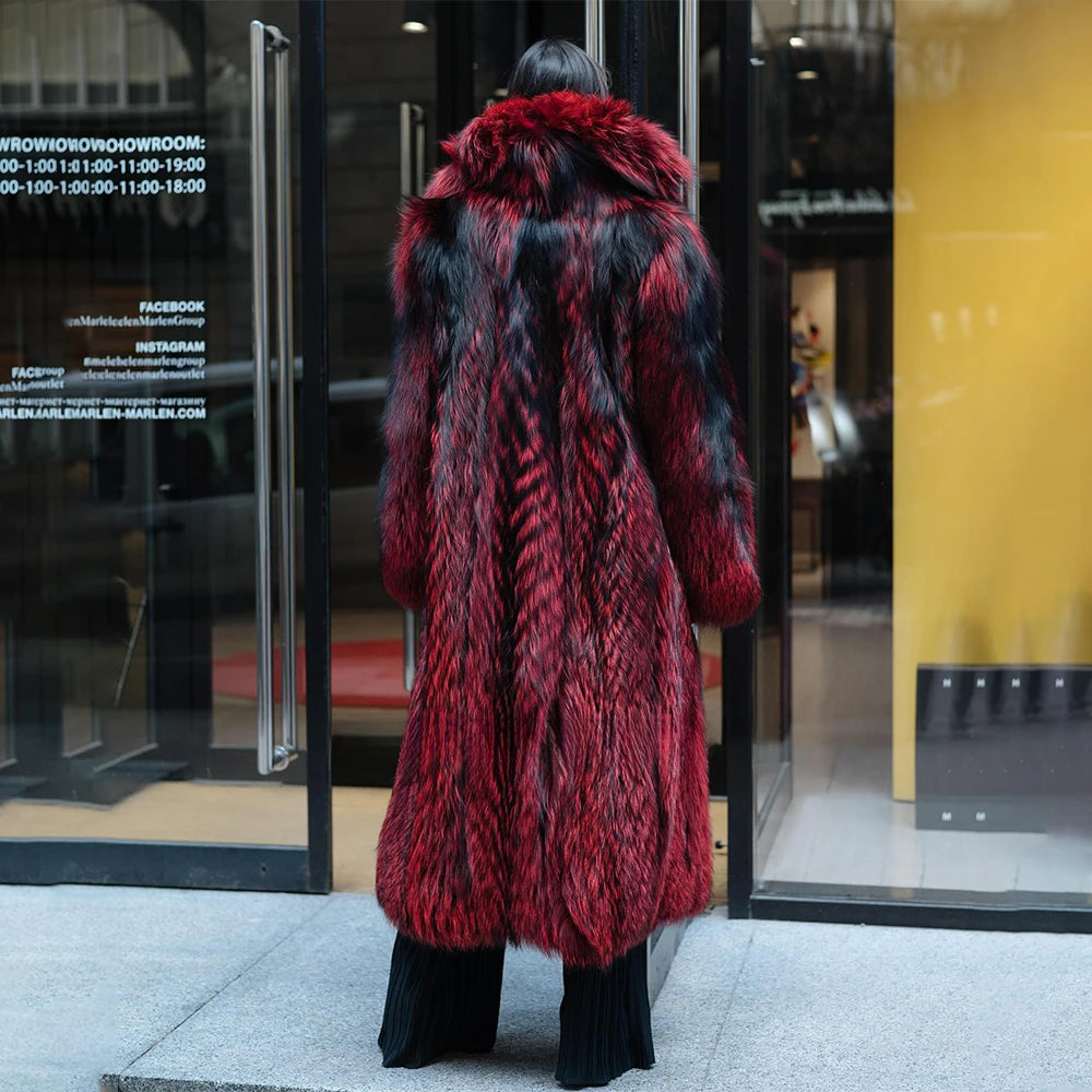 A model seen from behind in a Women's Monarch Silver Fox Fur Coat, the cascading silver fox fur moving with her as she walks, leaving behind an impression of effortless confidence. From Borcelleclothes.