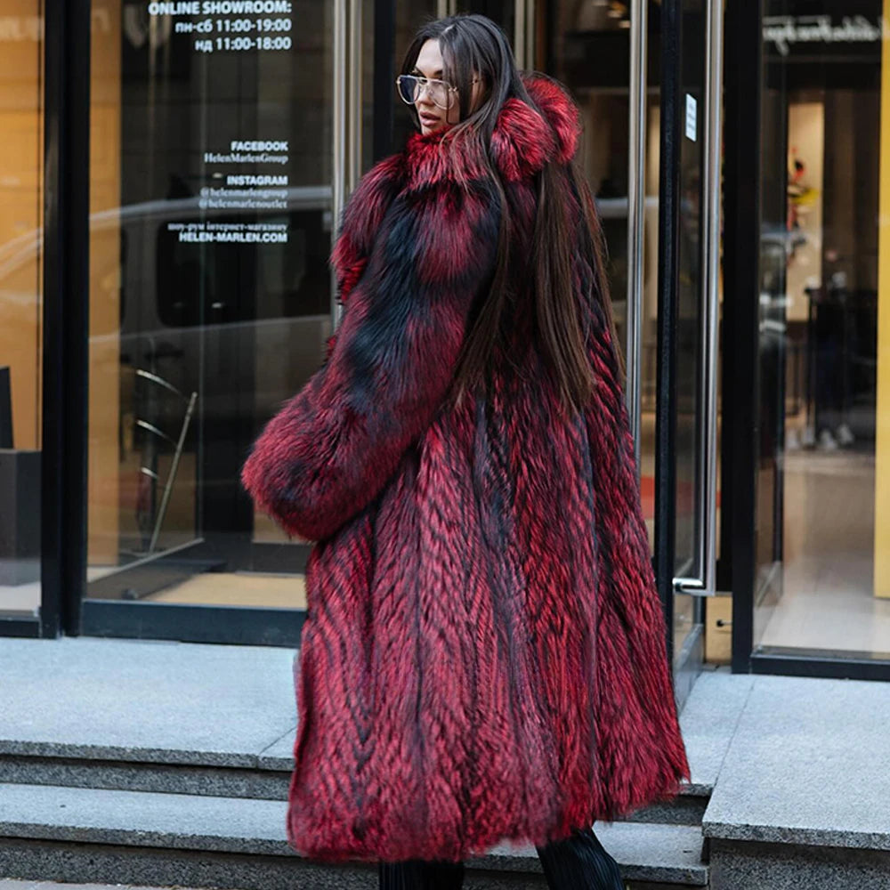 A model in a Women's Monarch Silver Fox Fur Coat glances back over her shoulder, exuding quiet confidence and an undeniable presence in the commanding hue of Monarch red. From Borcelleclothes.