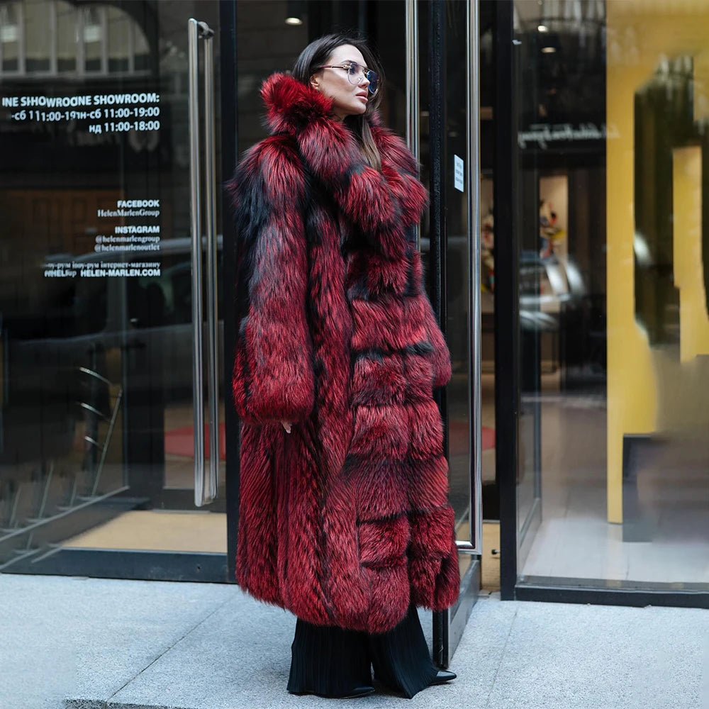 A model wearing a Women's Monarch Silver Fox Fur Coat, turned slightly to the side, showcasing the balance between its structured silhouette and the opulent softness of silver fox fur. From Borcelleclothes.