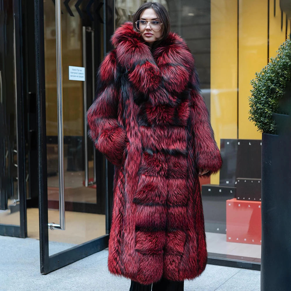 A model in a Women's Monarch Silver Fox Fur Coat gazes to the side, the expanded shawl collar embracing her with indulgent softness while the mid-calf length allows effortless movement. From Borcelleclothes.