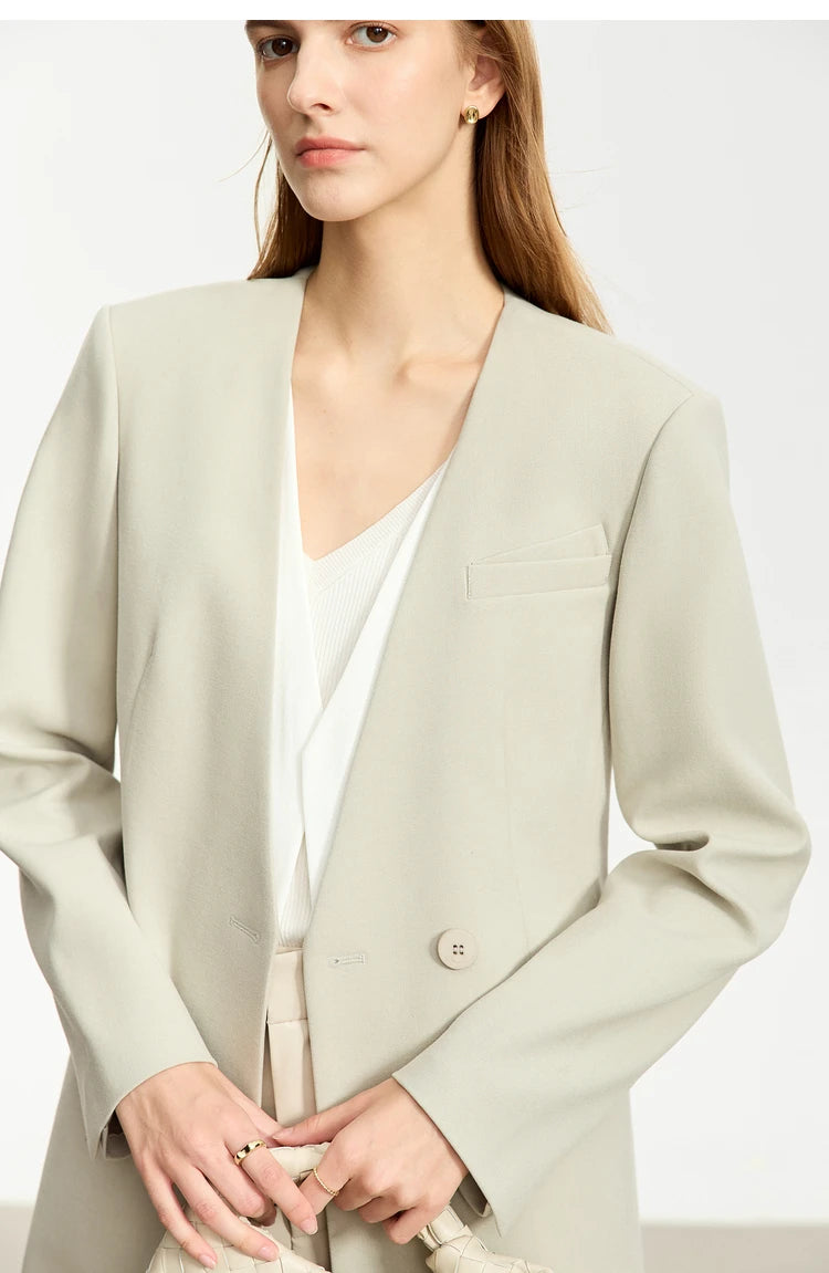 Women’s Moon Mist wrap blazer, model touching fingers gently – From Borcelleclothes.