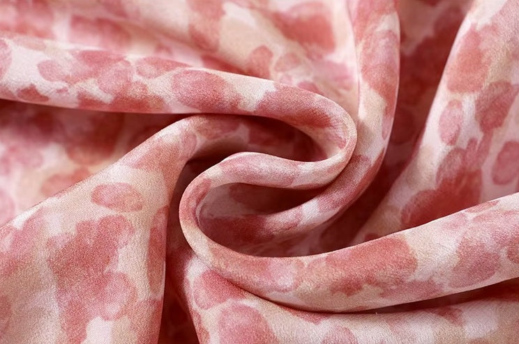 Chiffon fabric arranged in a serpentine drape—showcasing the softness, lightness, and fluidity of the silk. From Borcelleclothes.