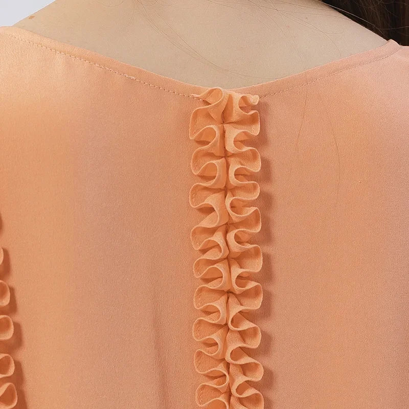 Back upper view of the silk dress in Folklore Rose, showing gathered ribbons. From Borcelleclothes.