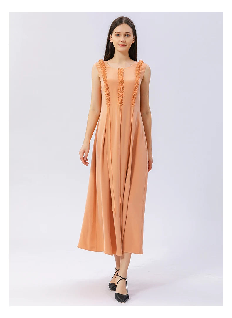 Model stepping forward in mulberry silk dress in Folklore Rose color, revealing fluid drape. From Borcelleclothes.