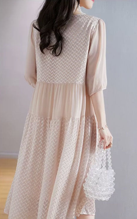 Back view of the Clam Shell georgette dress, revealing gentle gathers and the layered texture along the flowing silhouette. From Borcelleclothes.