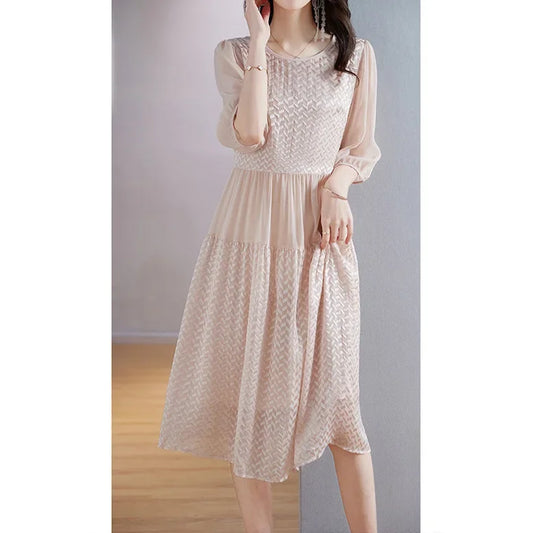 Mulberry silk georgette dress in Clam Shell, featuring embossed geometric texture with contrasting matte and sheen surfaces that shift with light. From Borcelleclothes.