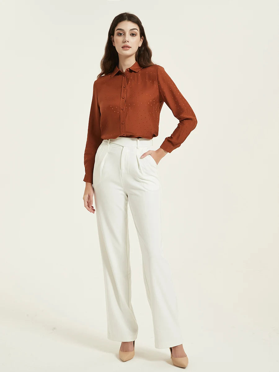 Model wearing the Women's Mulberry Silk Jacquard Dots Shirt in Sienna, with her hand in the pants pocket. From Borcelleclothes.