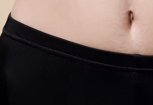 Detailed stitching and textured fabric on the waist of a Women's Mulberry Silk Leggings in Onyx, crafted from 100% silk for a luxurious and elegant fit. From Borcelleclothes.