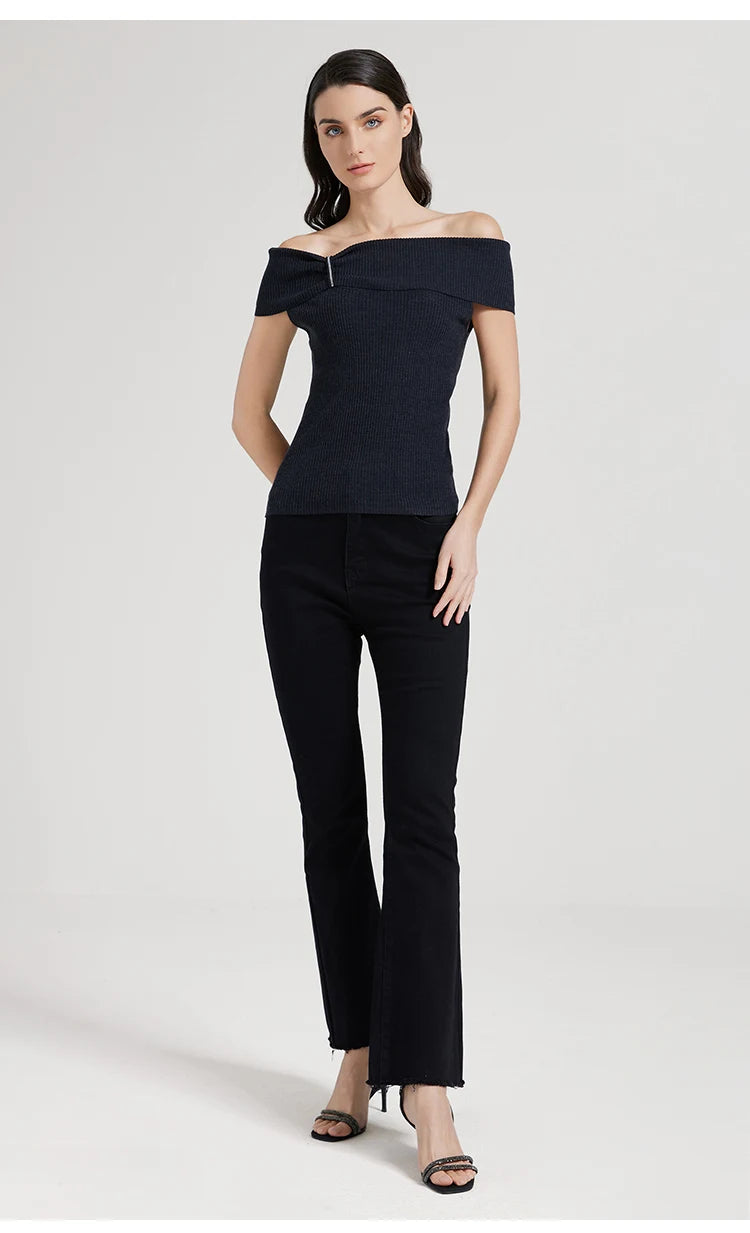 Model wearing the Black Pearl top, one hand placed behind the body. From Borcelleclothes.