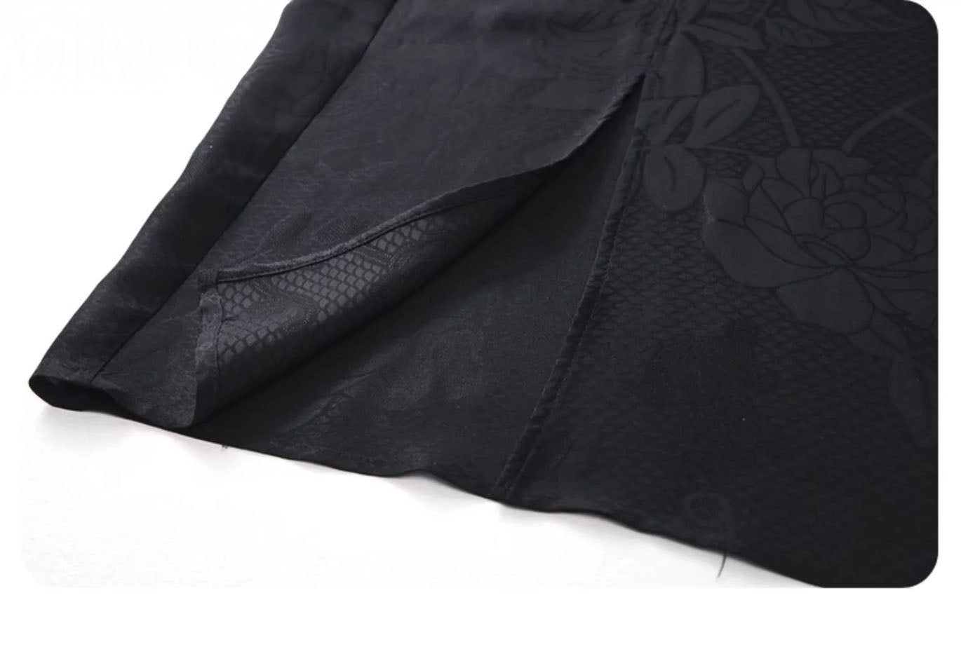Right-side slit with folded fabric detail on the Onyx jacquard silk skirt. From Borcelleclothes.