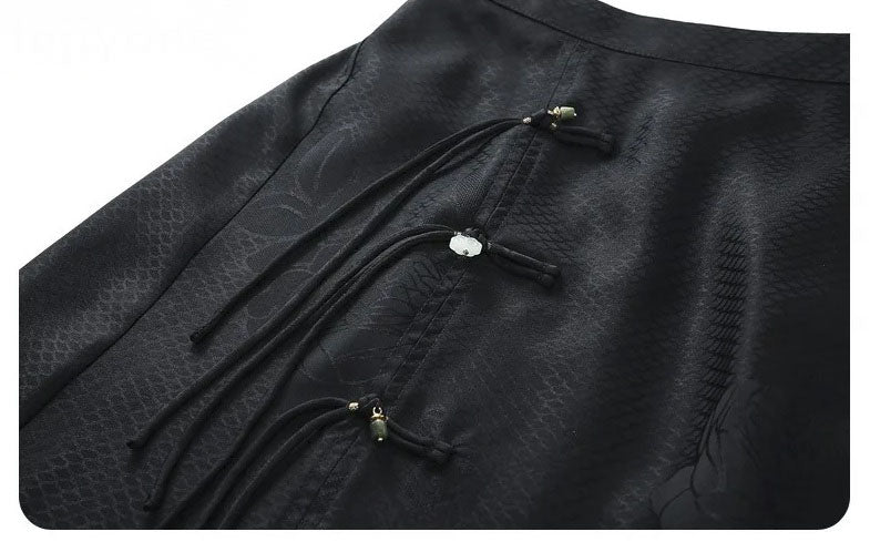 Decorative silk loops and folded ties on the right side of the Onyx jacquard skirt. From Borcelleclothes.