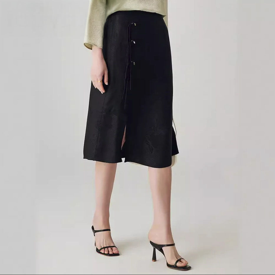 Onyx jacquard skirt in motion as model steps forward. From Borcelleclothes.