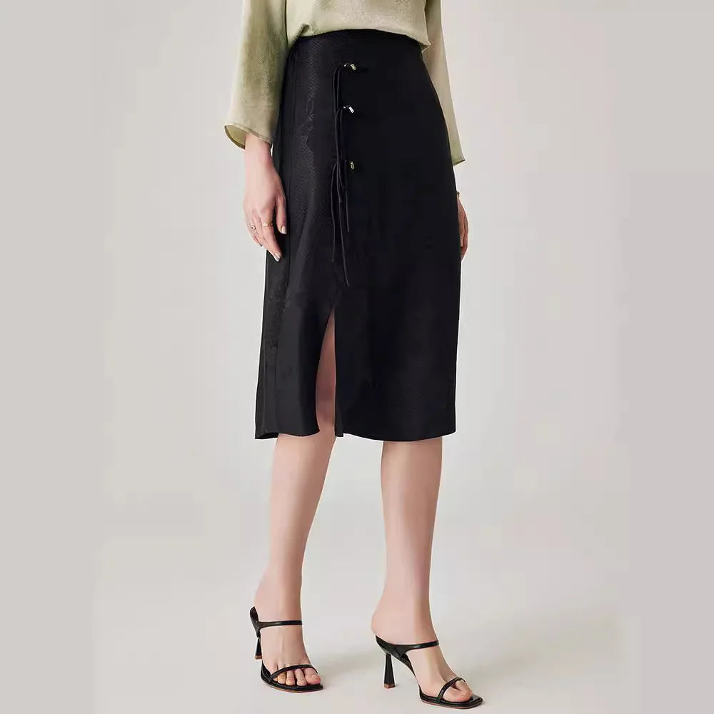 Model in Onyx silk jacquard skirt turned slightly to the side, revealing shape and texture. From Borcelleclothes.