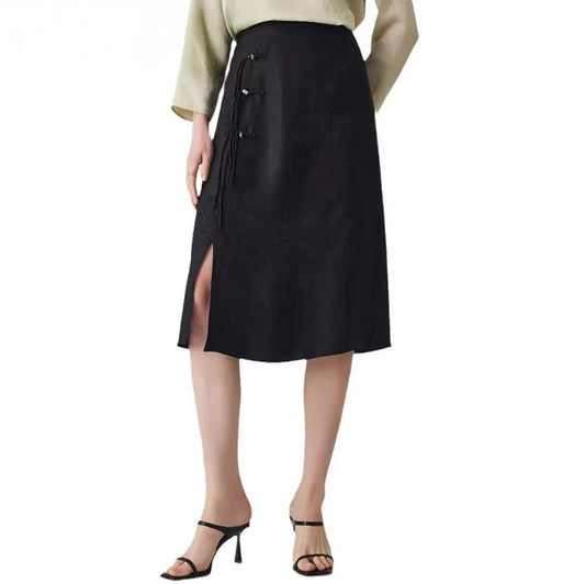 Women's knee-length jacquard skirt in Onyx with a subtle floral pattern, featuring a front slit, decorative loops, and silk folded ties. From Borcelleclothes.