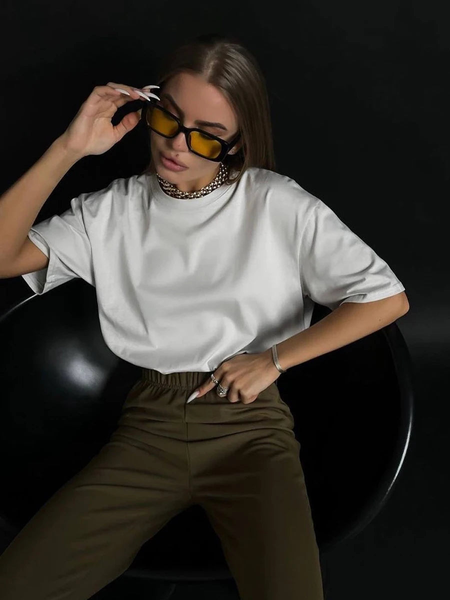 Women's Oversized Cotton T-Shirt in White, featuring a relaxed fit with a crew neck and short sleeves. Made from 100% cotton, this t-shirt offers comfort and versatility, perfect for casual styling in a trendy, solid color. From Borcelleclothes.