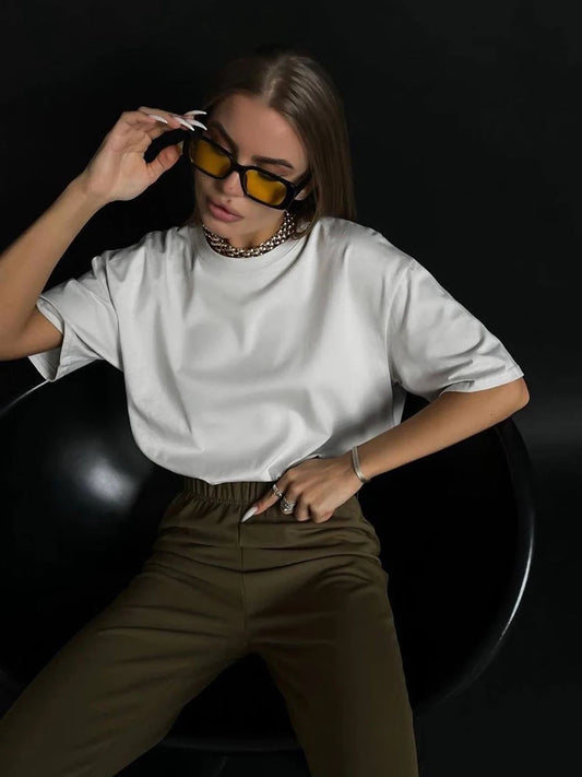 Women's Oversized Cotton T-Shirt in White, featuring a relaxed fit with a crew neck and short sleeves. Made from 100% cotton, this t-shirt offers comfort and versatility, perfect for casual styling in a trendy, solid color. From Borcelleclothes.