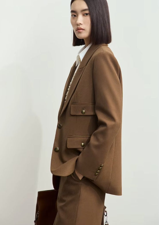 Side view of the peaked-lapel blazer in Irish Coffee, showing the gently shaped waist and confident structure. From Borcelleclothes.