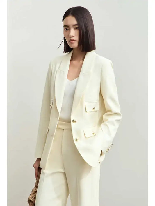 Women’s peaked-lapel blazer in Sugar Cane — a single-breasted design with pointed lapels and convex brass buttons, crafted in a deep, composed shade that absorbs attention with quiet strength. From Borcelleclothes.