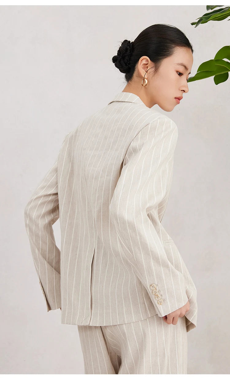 Back view of the Pearl Bush striped blazer showing clean seams and central vent on model. From Borcelleclothes.