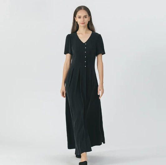 Women's pinstripe silk wrap dress in Jaguar color featuring a V-neckline, six pearl-like buttons to the waist, sculptural inverted box pleats. From Borcelleclothes.