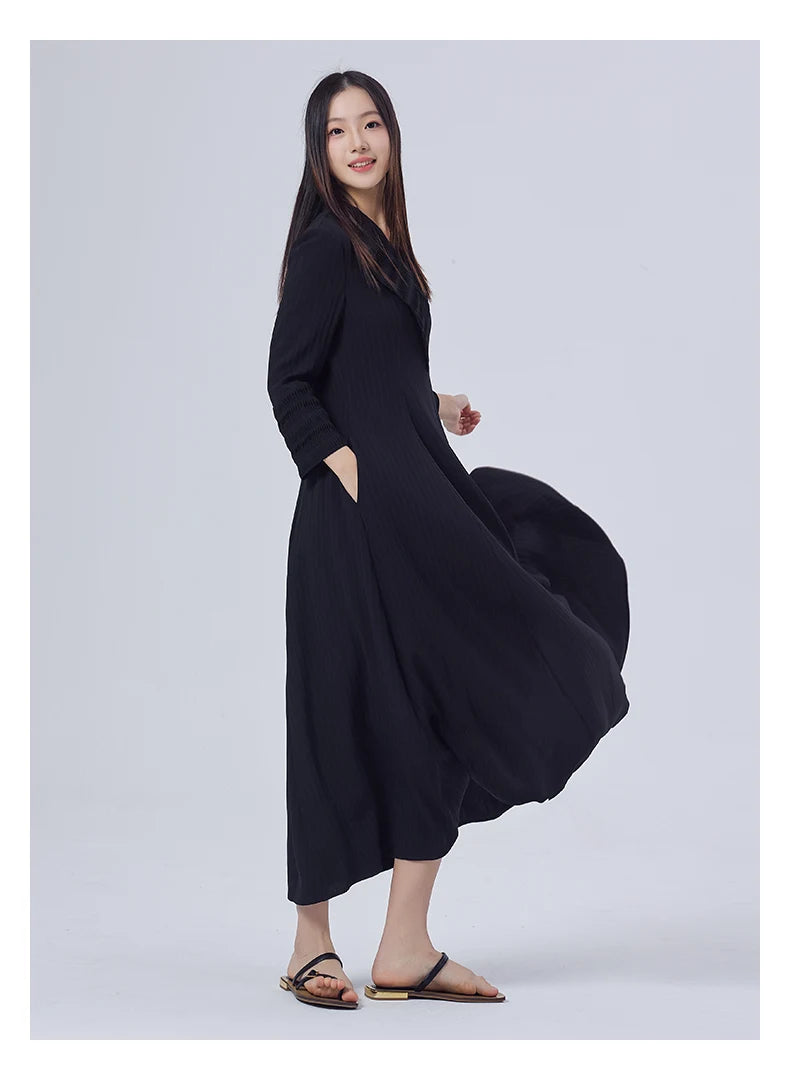 Side view of the dress, showing the defined silhouette and balance between structure and fluidity. From Borcelleclothes.