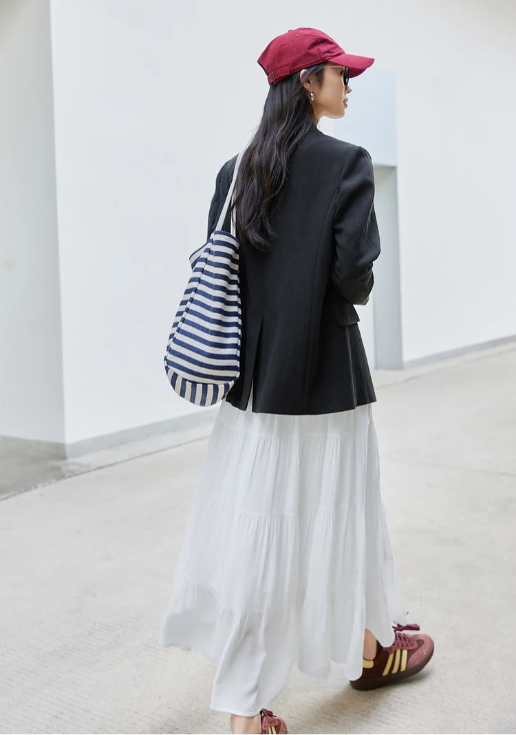 Back view of a woman in the Onyx Urban Blazer. From Borcelleclothes.