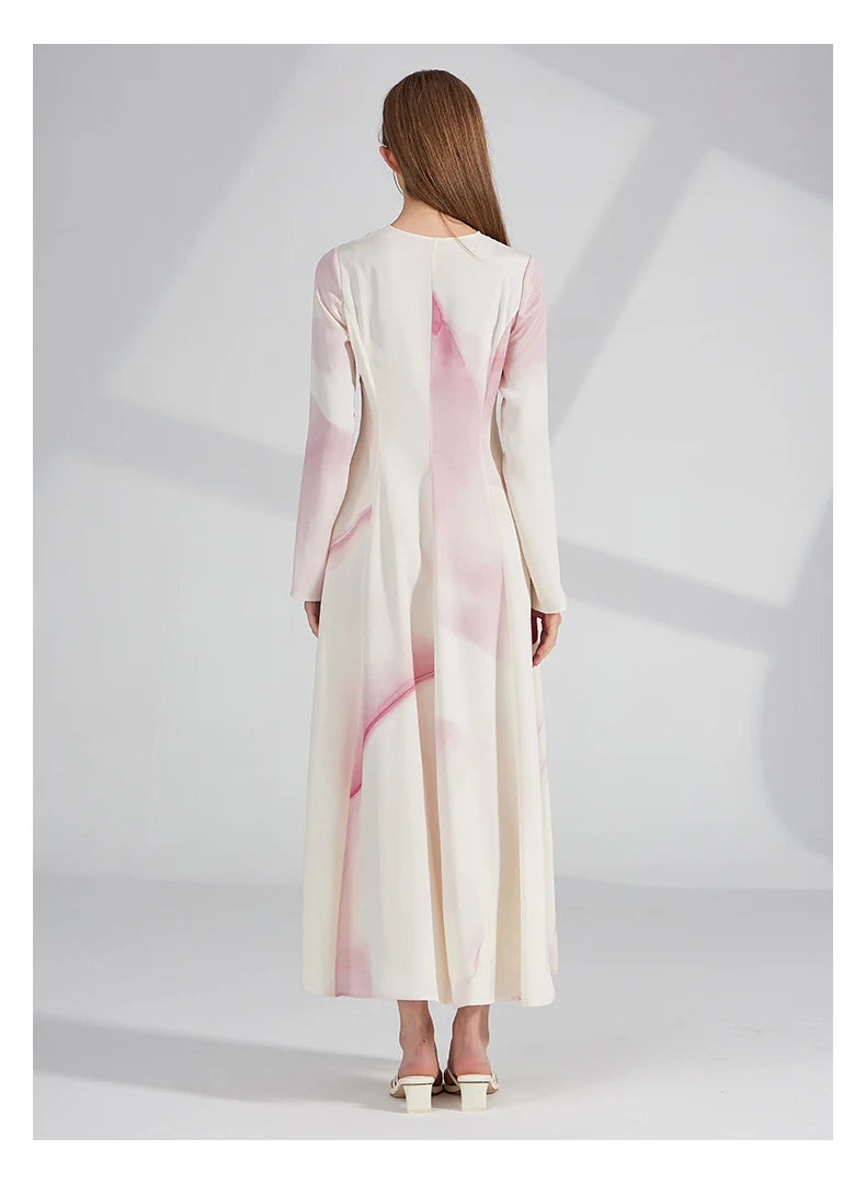 Full back view of the silk dress, revealing its flared silhouette and ankle length. From Borcelleclothes.