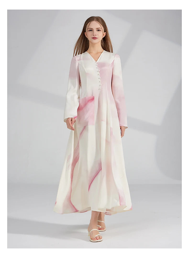 Model stepping forward in the flared silk dress, capturing the fluidity of the hem. From Borcelleclothes.