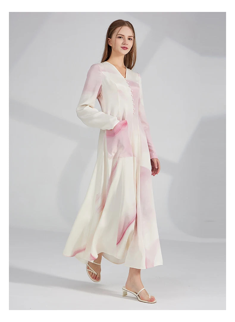 Model walking with one hand in the pocket, showing the dress in natural motion. From Borcelleclothes.