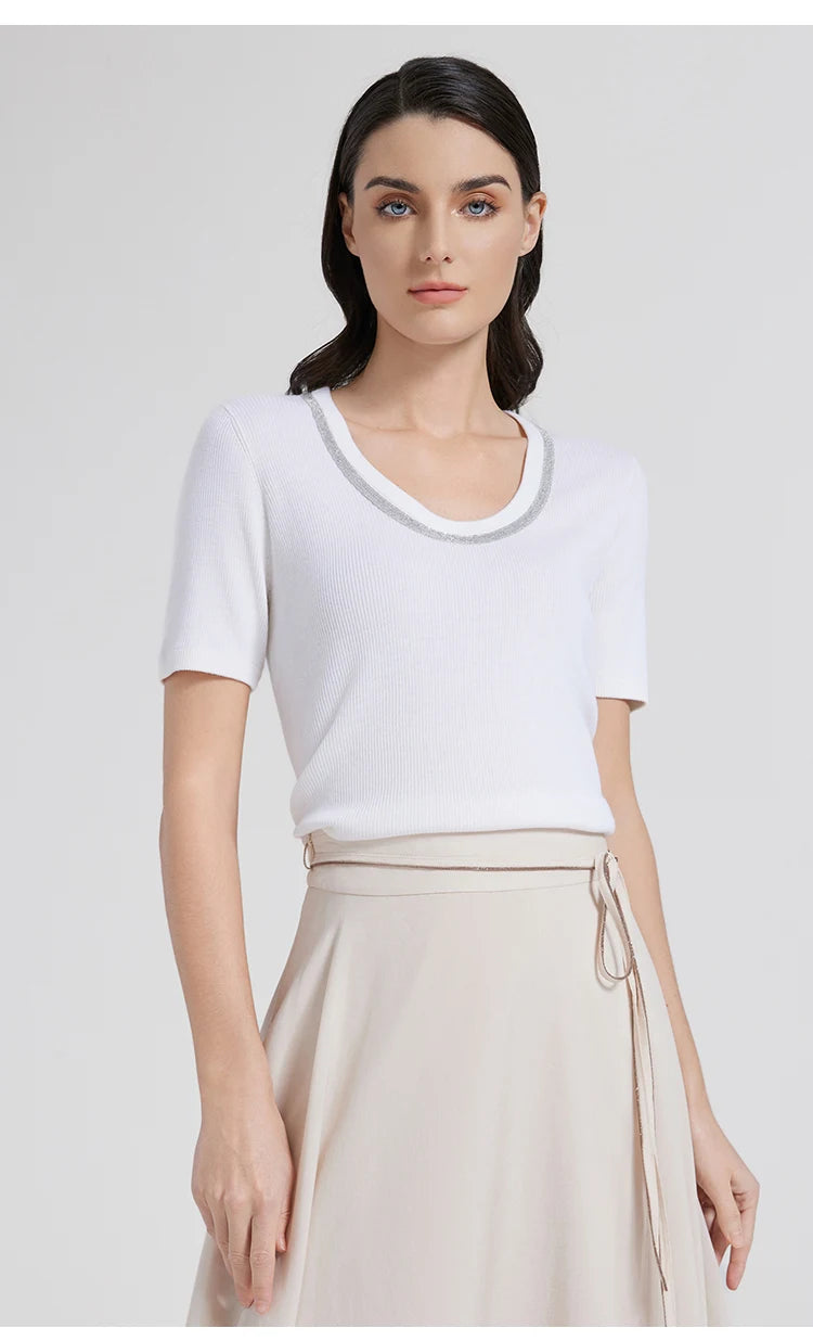 Front view of woman in Merino wool and silk top with arms straight, showing the balanced proportions and understated sleeves. From Borcelleclothes.