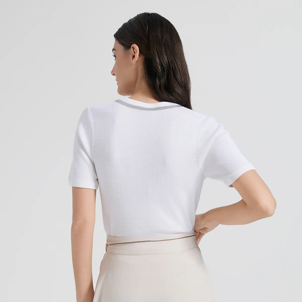 Back view of slim-fit knit top in White Lilac, emphasizing the smooth construction and flattering cut. From Borcelleclothes.
