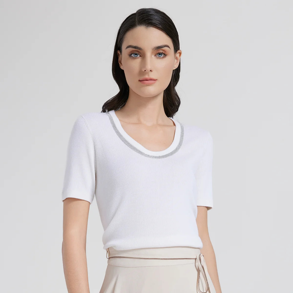 Women’s slim-fit Merino wool and silk top in White Lilac with soft oval neckline and delicate rhinestone fringe detail. From Borcelleclothes.