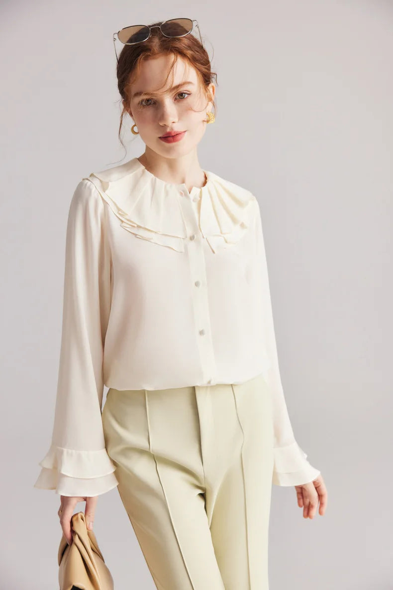 Model wearing the Women's Romantic Pearl Bush Silk Blouse, bent slightly side to showcase the vintage-inspired double pilgrim collar. From Borcelleclothes.