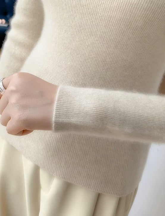 The end of the sleeve of the women's Saddle Sleeves Cashmere Sweater in Soft Amber, highlighting the ribbed cuff and precise craftsmanship, Borcelleclothes.