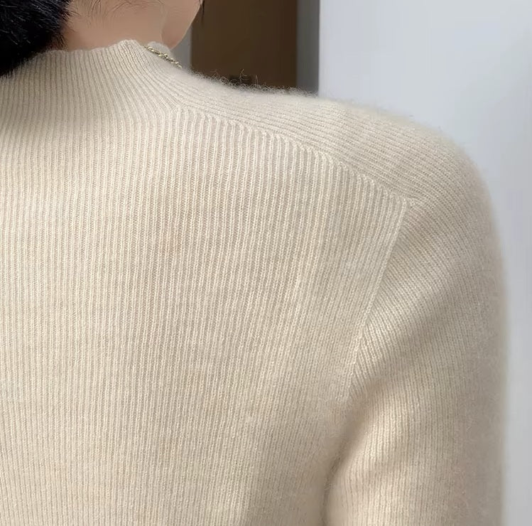The shoulder of a the women's Saddle Sleeves Cashmere Sweater in Soft Amber, highlighting the structured saddle sleeve design, Borcelleclothes.