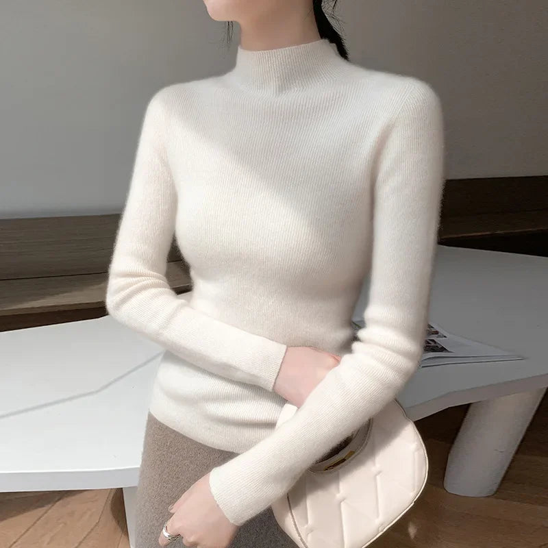 A model wearing the women's Saddle Sleeves Cashmere Sweater in Spring Wood bent arm. From Borcelleclothes.