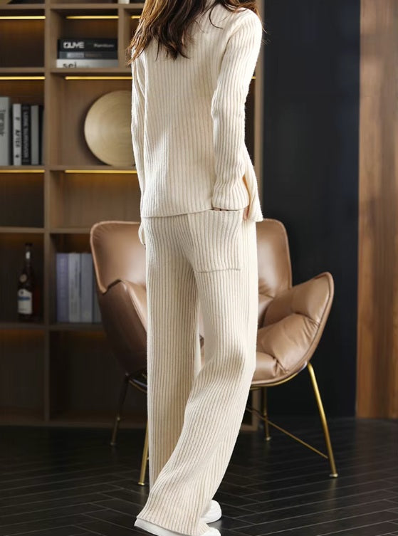 Model wearing the women's Sculpted Wool Set in Soft Amber, showcasing the ribbed texture and relaxed fit, with one hand placed in the pants pocket, Borcelleclothes.