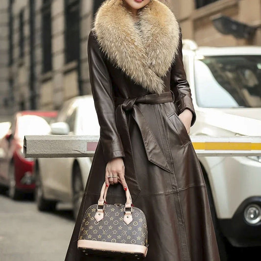 Women's Sheepskin Down Coat in Eclipse. Model holds a Louis Vuitton bag, showcasing the coat’s refined elegance and commanding presence. Borcelleclothes.