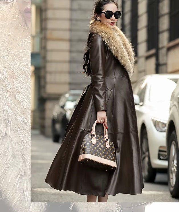 Women's Sheepskin Down Coat in Eclipse. Model in side profile, showcasing the coat’s structured tailoring and graceful movement. Borcelleclothes.