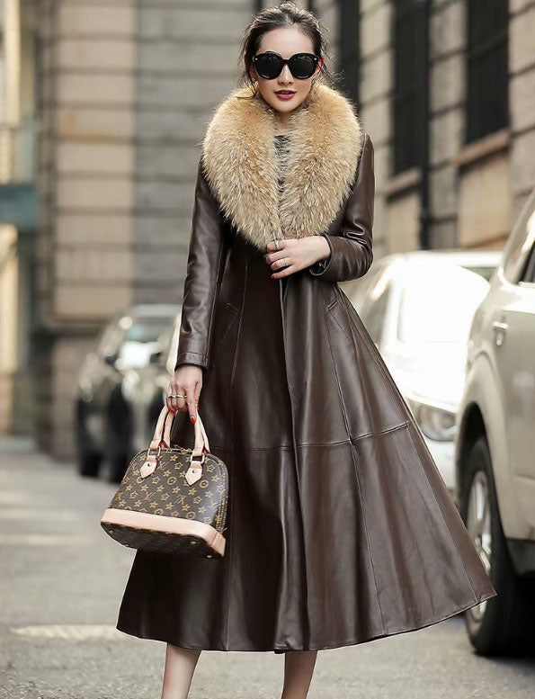 Women's Sheepskin Down Coat in Eclipse. Model touches the coat’s front, emphasizing the soft yet structured leather drape. Borcelleclothes.