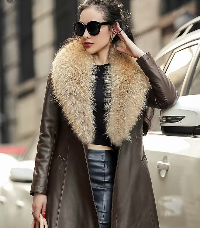 Women's Sheepskin Down Coat in Eclipse. Model touches her hair, highlighting the coat’s sleek elegance and relaxed sophistication. Borcelleclothes.