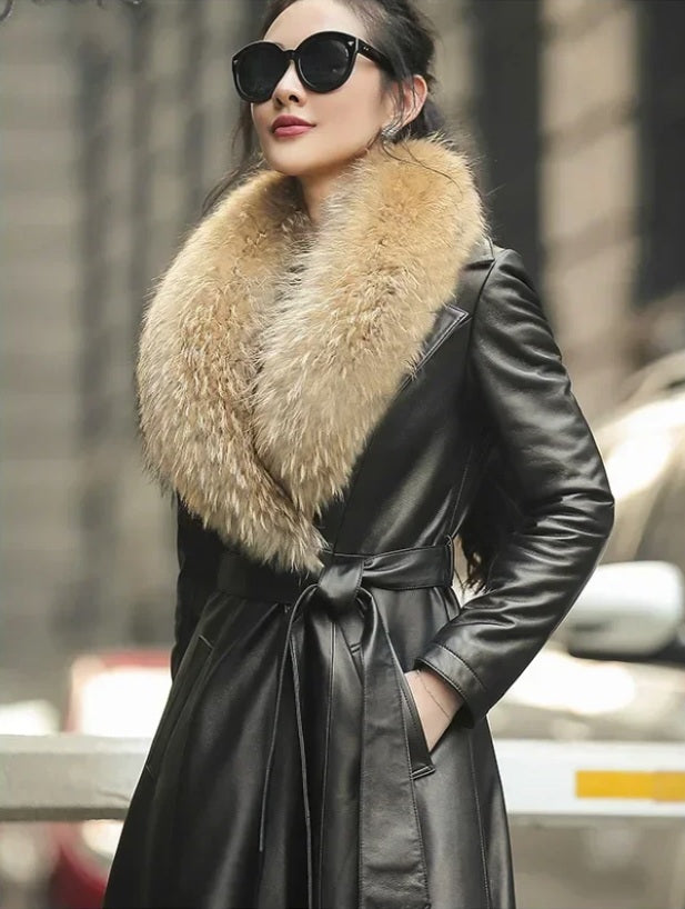 Women's Sheepskin Down Coat in Onyx. Model places hand in the pocket, emphasizing refined craftsmanship and seamless design. Borcelleclothes.