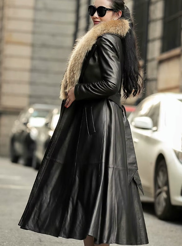 Women's Sheepskin Down Coat in Onyx. Model in side profile, highlighting the structured tailoring and sophisticated length. Borcelleclothes.