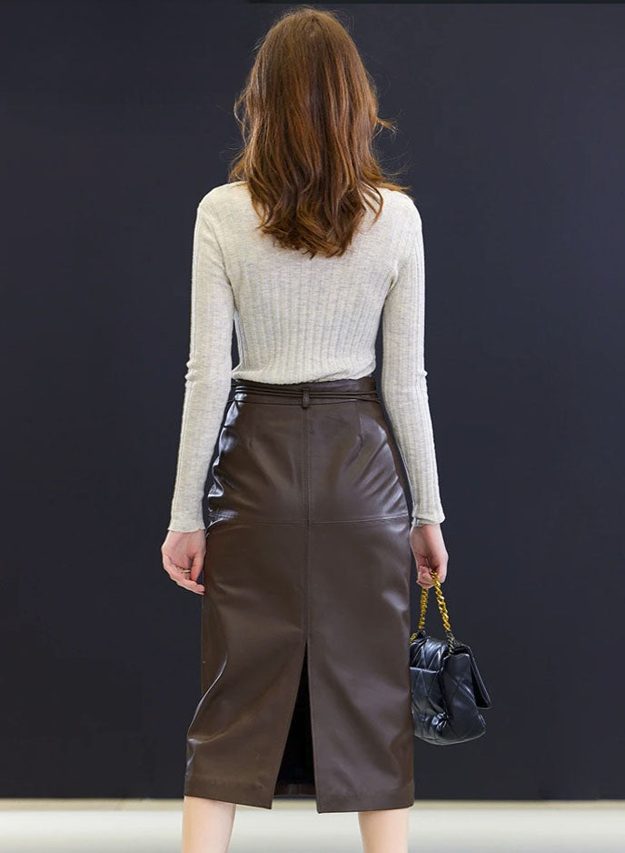 Back view of the Dark Rum sheepskin skirt — tailored structure with a central vent, offering clarity in motion and design. From Borcelleclothes.