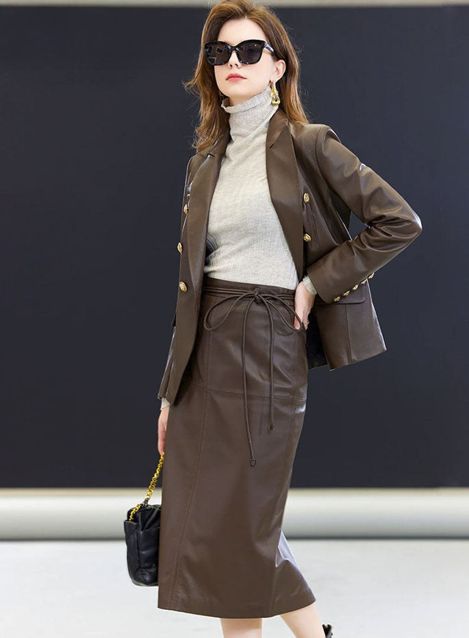 Model wearing the Dark Rum skirt paired with the leather blazer — a full look defined by sculptural restraint and tonal depth. From Borcelleclothes.