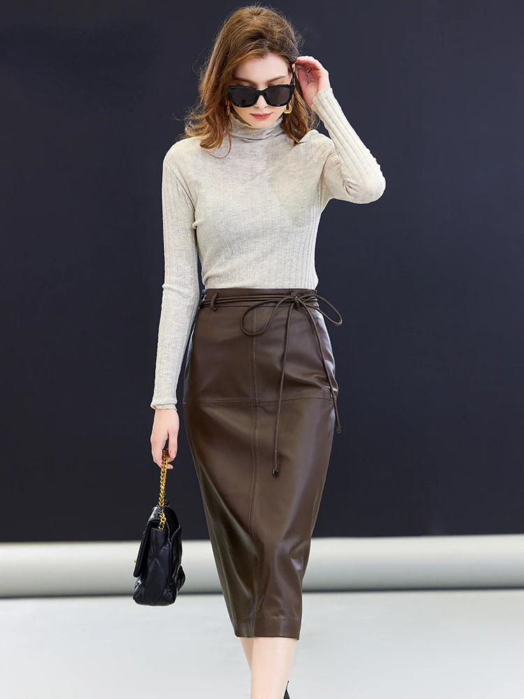 Women’s sheepskin midi skirt in Dark Rum — a straight silhouette in genuine leather with an extended tie waist, central back vent, and mid-calf length, crafted for quiet structure and poised movement. From Borcelleclothes.