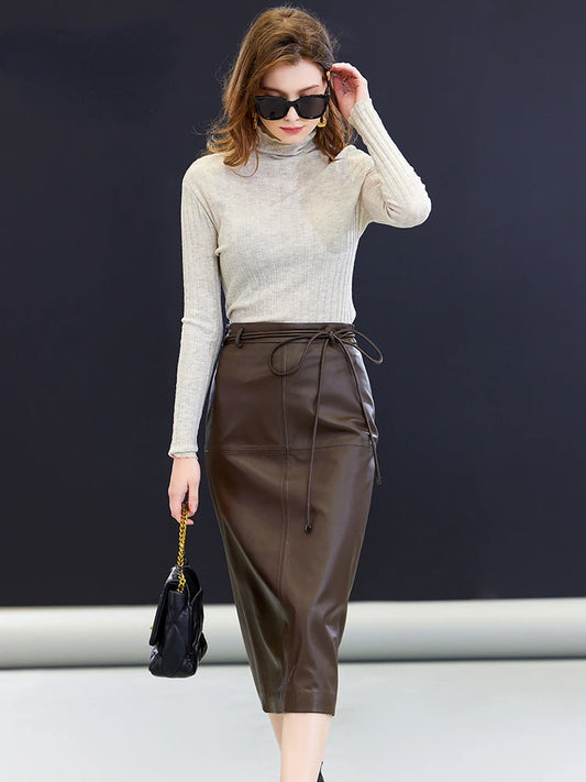 Women’s sheepskin midi skirt in Dark Rum — a straight silhouette in genuine leather with an extended tie waist, central back vent, and mid-calf length, crafted for quiet structure and poised movement. From Borcelleclothes.