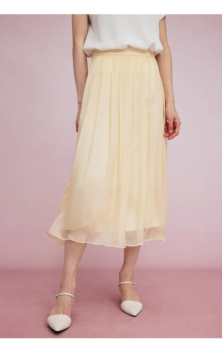 Model in Apricot White skirt with foot angled sideways, skirt in mid motion. From Borcelleclothes.